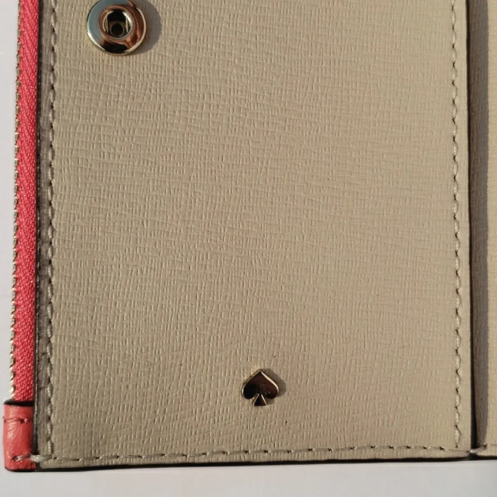 Kate Spade Leather Roulette Small Slim Bifold Wallet. Color: Peachmelba.